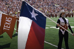 Woman holding a Texas Flag.